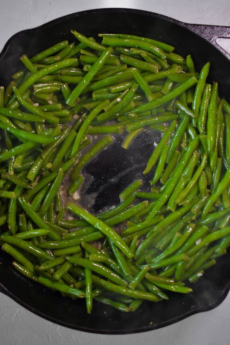 Green beans cooked till warmed through and pan deglazed with wine and boiled till nearly dry again.