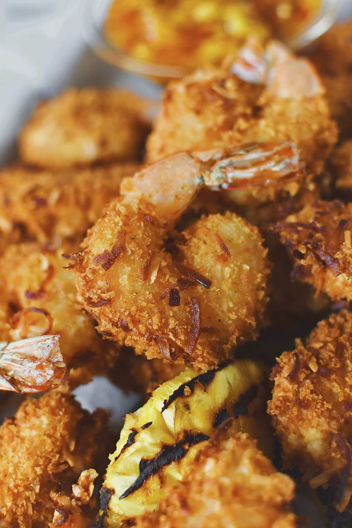 Fried Coconut Shrimp, hot and fresh and cooked to golden brown, ready to eat.