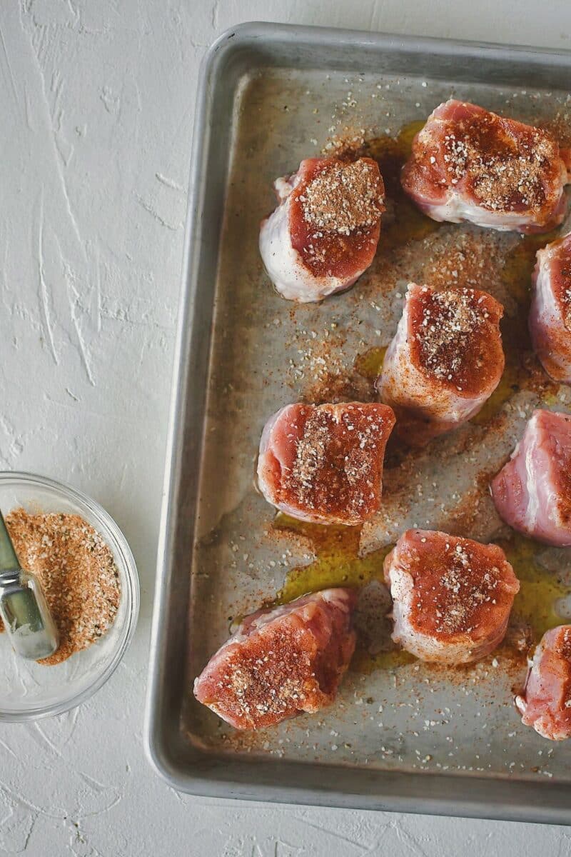 Seasoning the medallions with a mixture of salt, peppe, paprika, and roasted garlic powder.