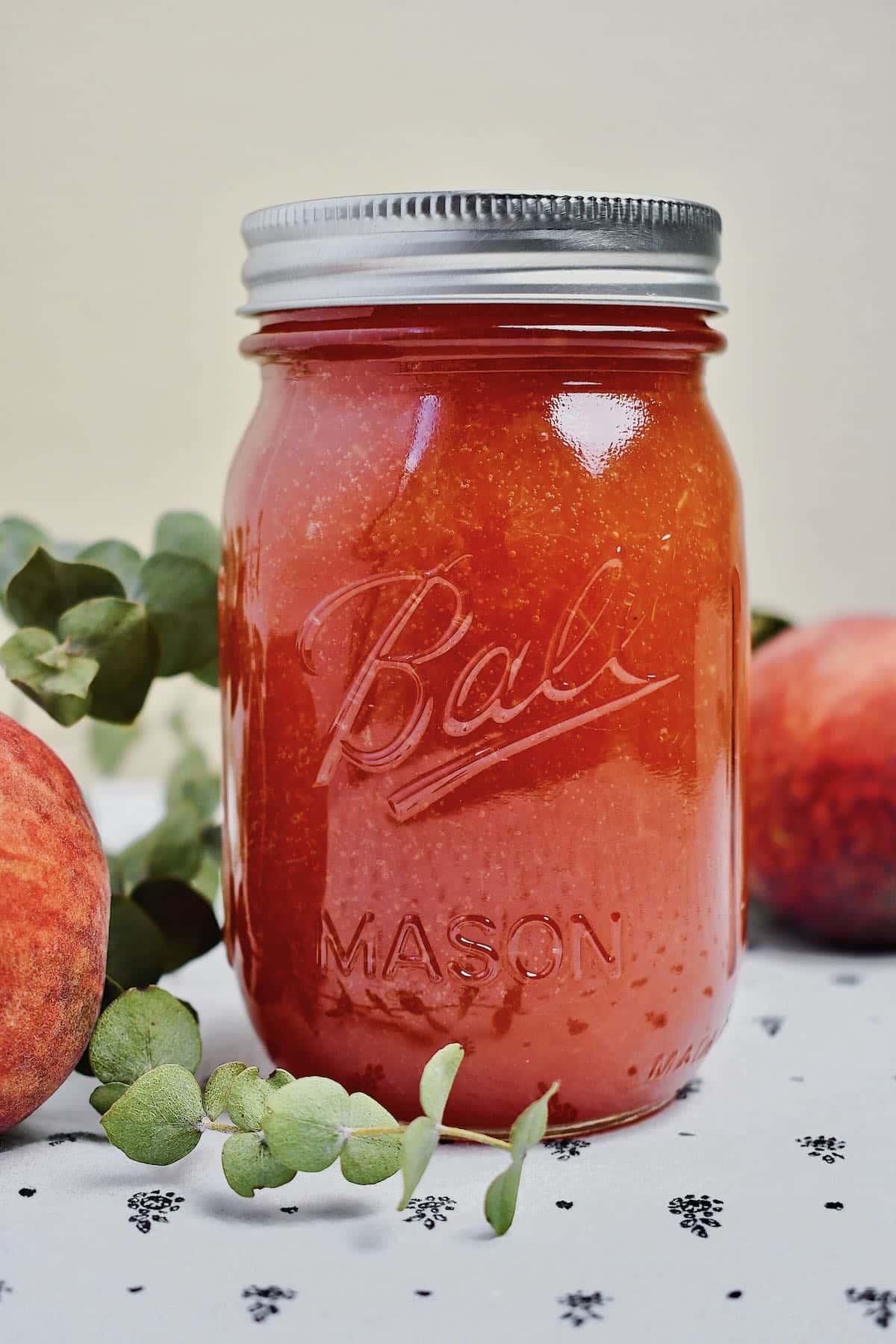 Peach Jam Recipe, in a jar cooling.