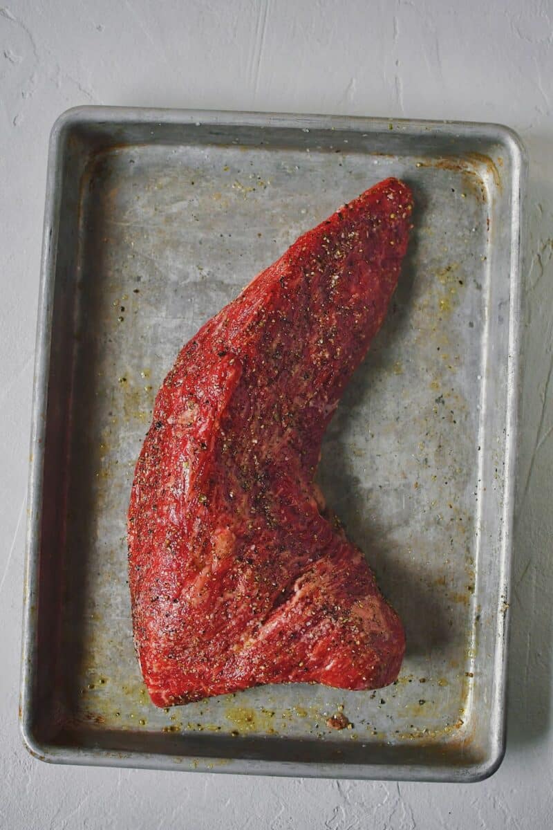 Tri-Tip seasoned with salt, pepper, and olive oil, resting till ready to cook.