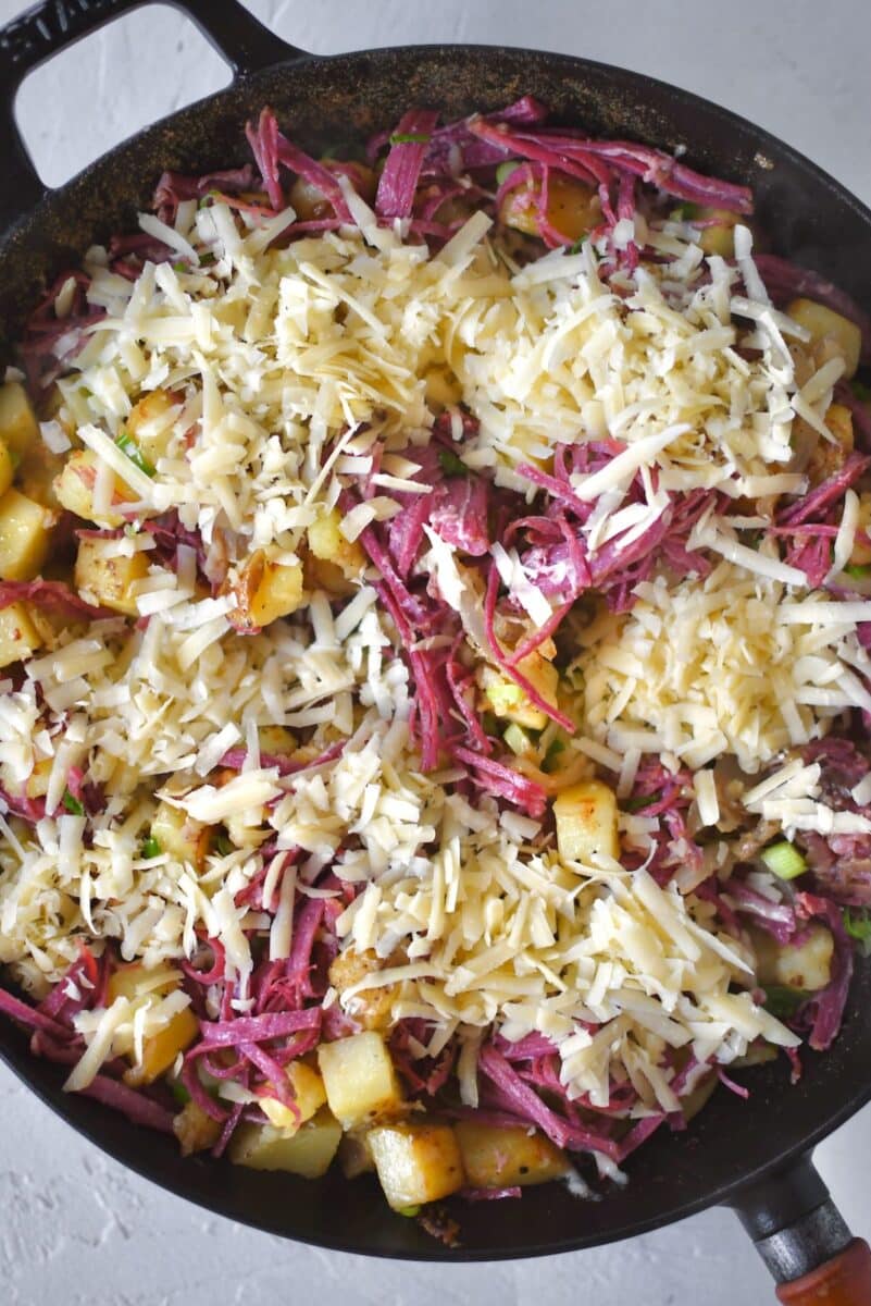 Corned beef stirred into the pan till warm, then topped with irish white cheddar.