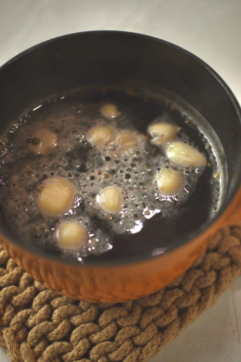 All brine ingredients, except the ice, in a small pot on the stove, warmed till the salt and sugar melt.