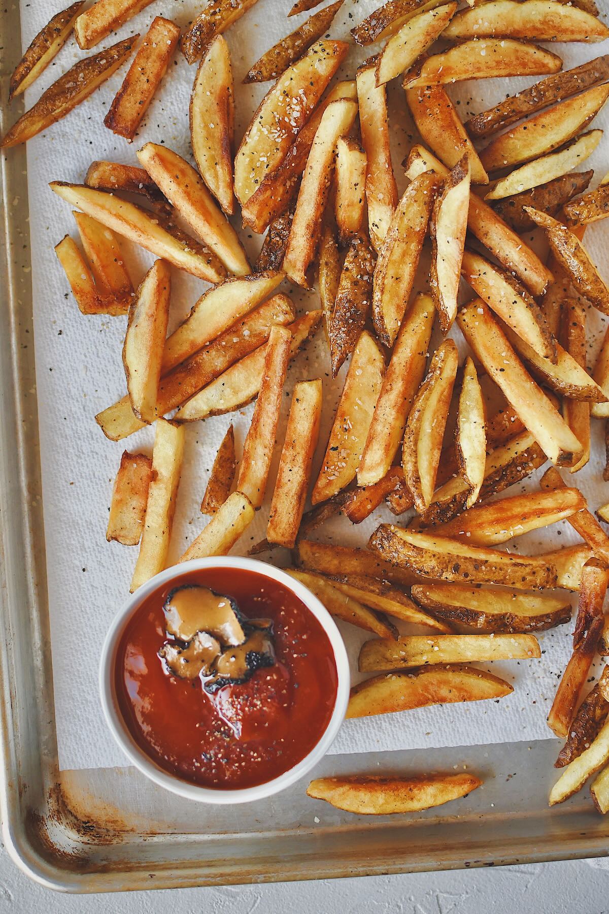 Frites, or french fries just out of the deep fryer, after the second cooking, cooked to a golden brown.