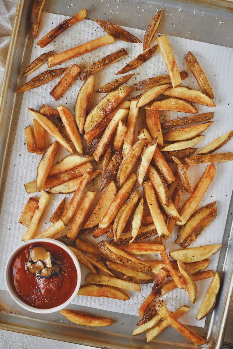 Frites, or french fries just out of the deep fryer, cooked to a golden brown.