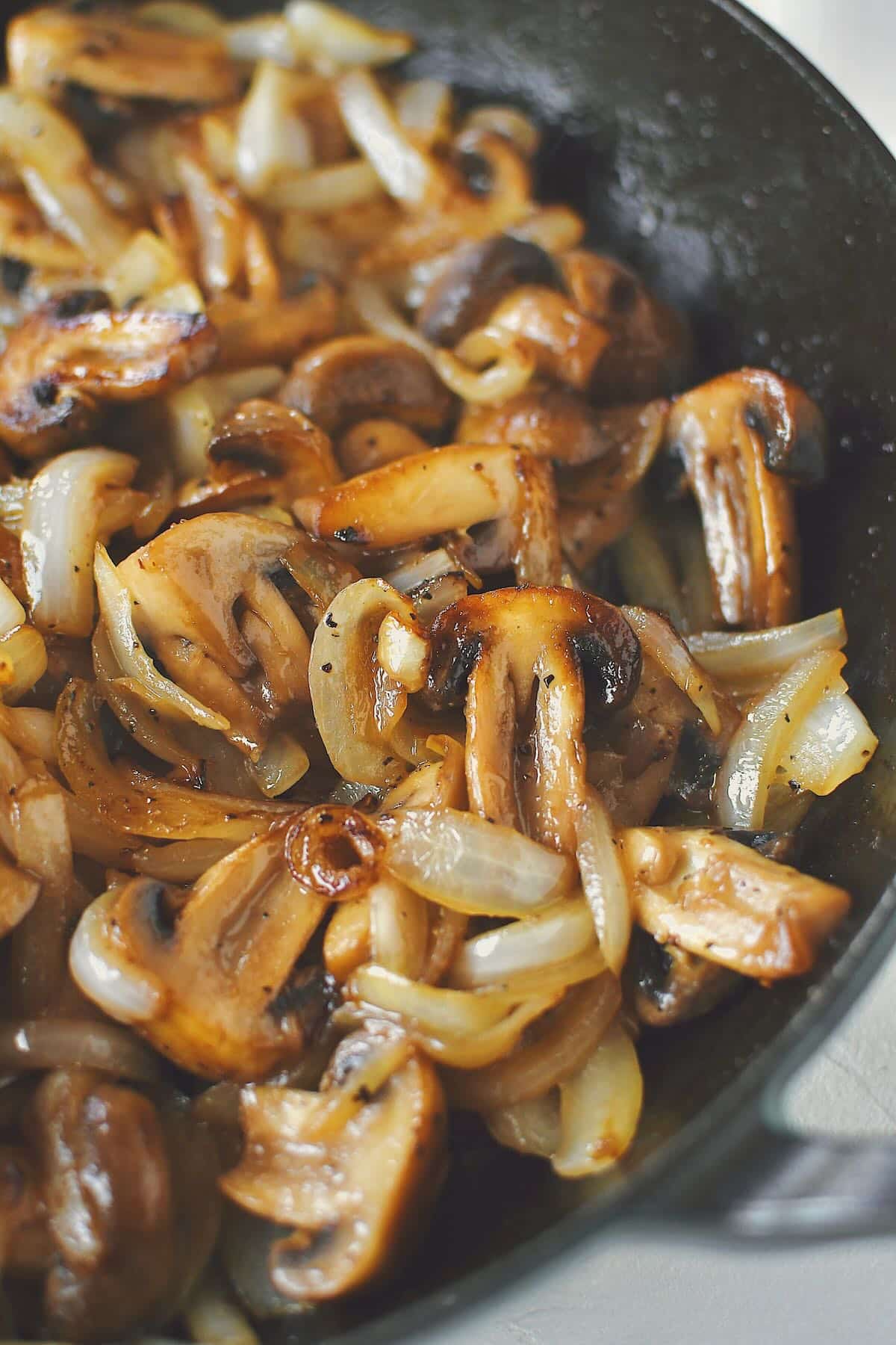 Sautéed Mushrooms and Onions, finished in the skillet, ready to be eaten.
