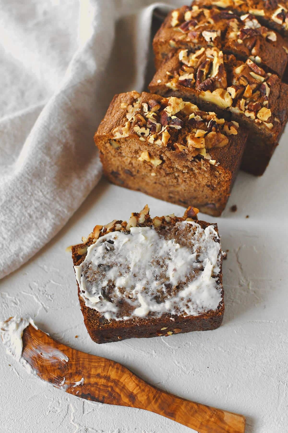 Sliced Starbucks Banana Bread Recipe ready to be enjoyed and topped with a smear of butter.