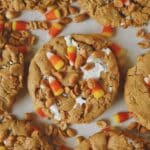 Finished Candy Corn Cookies laid out on a table with candy corn and peanuts snack mix under them, ready to eat!