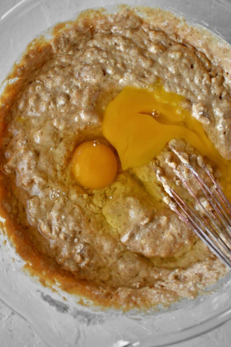 Whisking the eggs into the pancake batter.