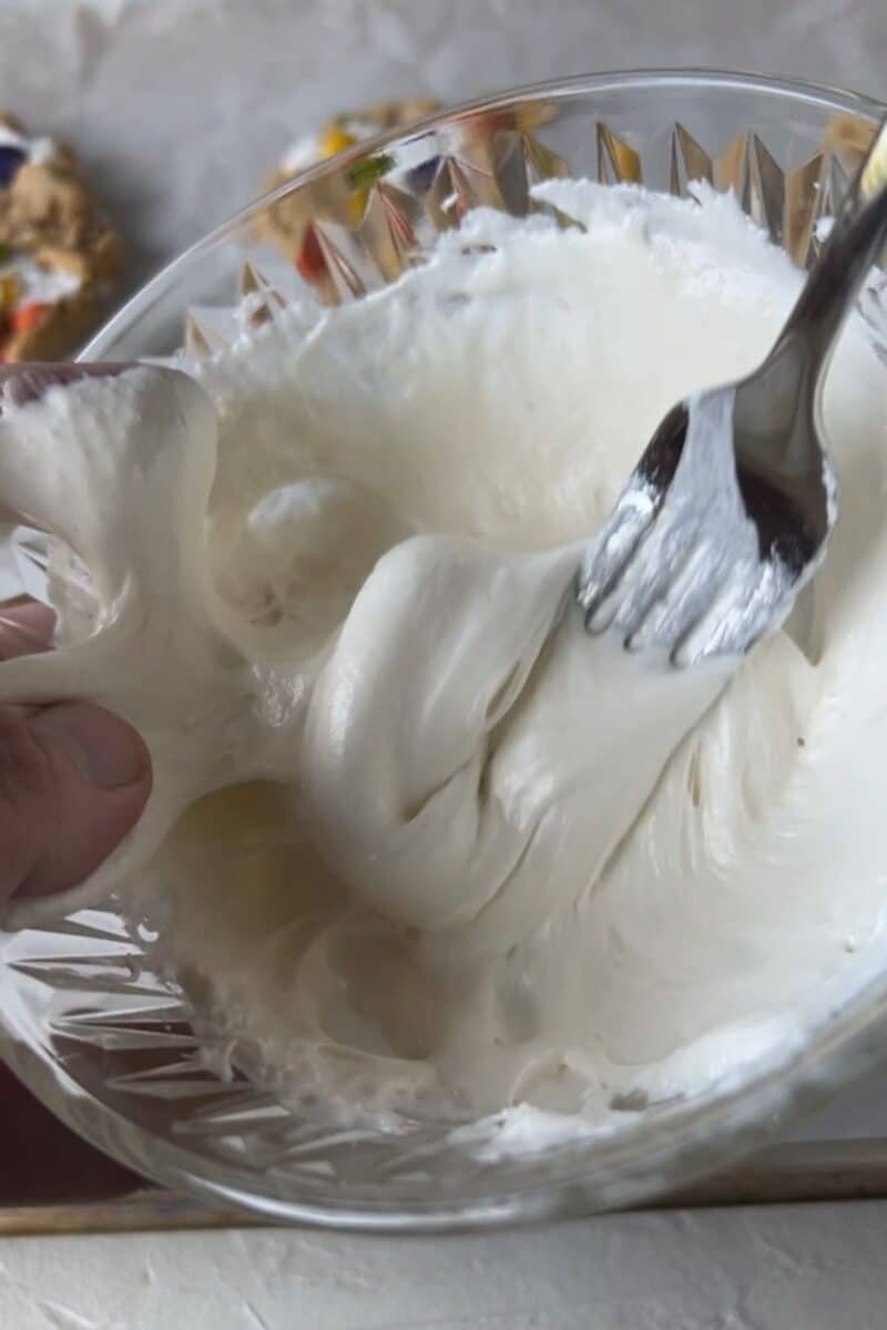 Melting marshmallows to make stretchy spider webs.