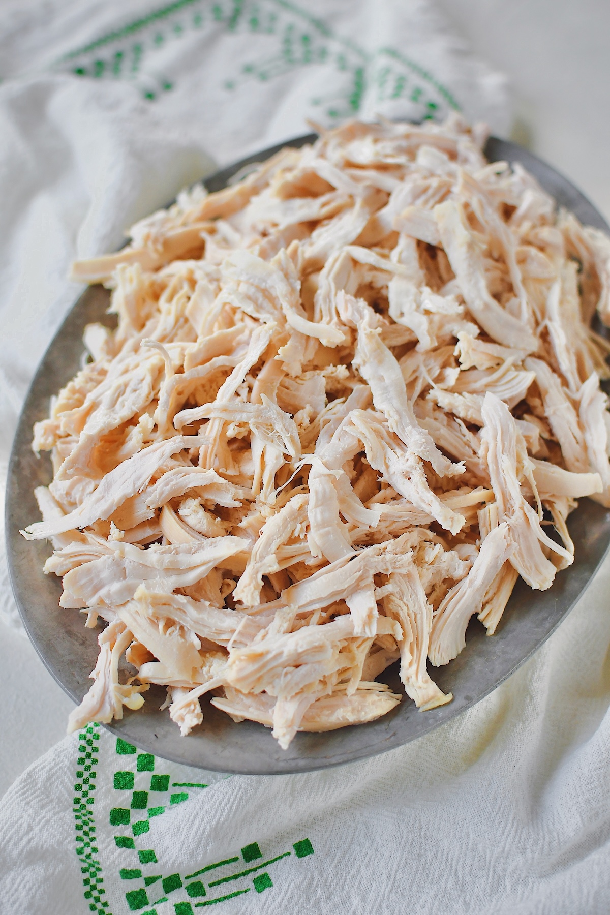 Poached chicken, ready to be used, after shredding.