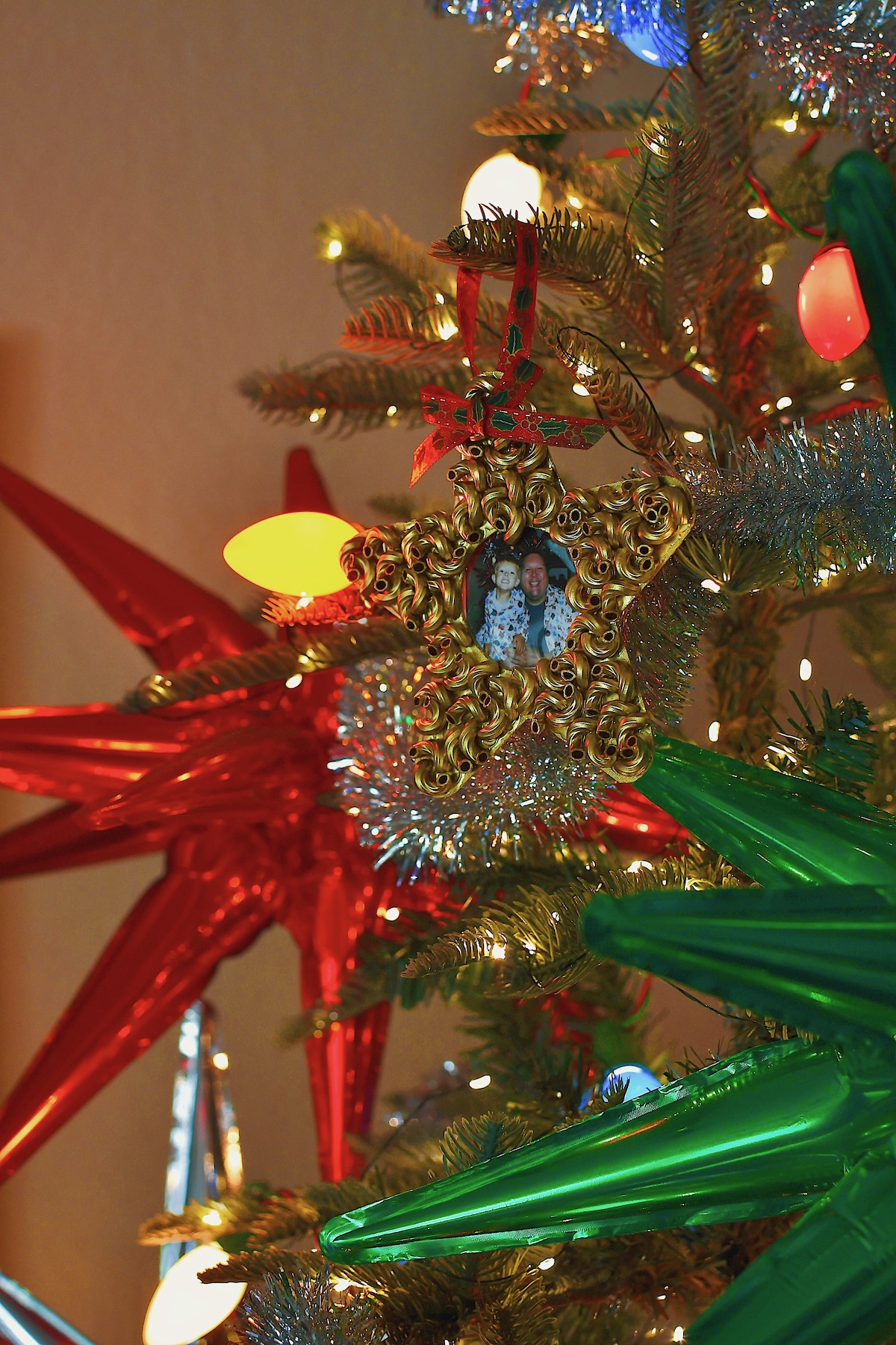 Macaroni Start Pasta Christmas Ornament, on a beautifully decorated tree.