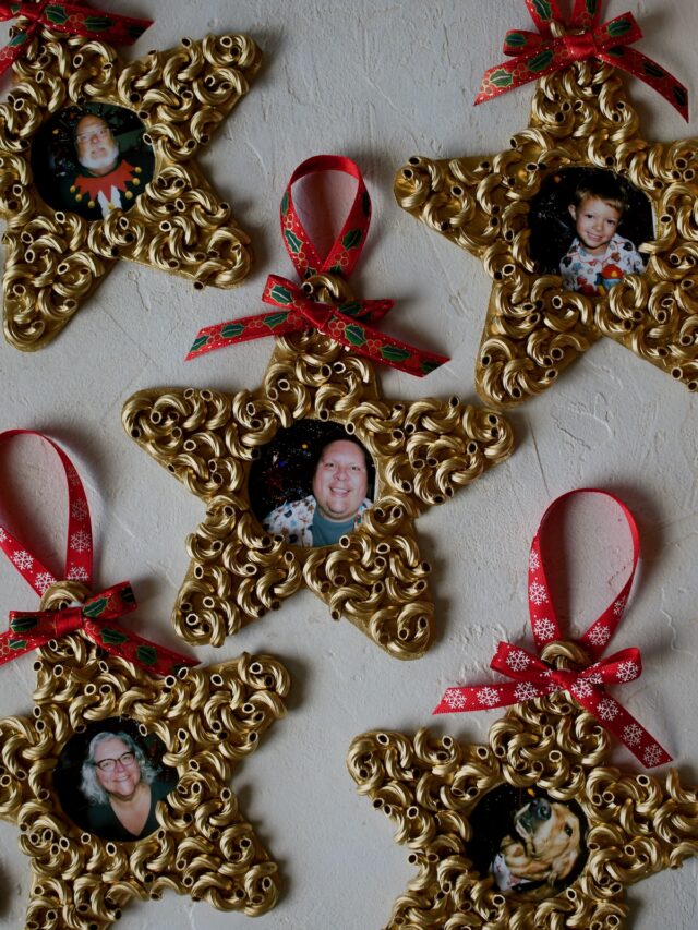 Family photos fill the easy pasta christmas ornaments, completed and sitting on the table.