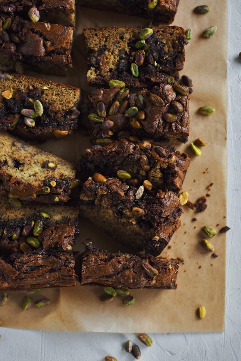 Pistachio Banana Bread, inspired by a dubai chocolate bar, swirled with nutella and studded with pistachios.