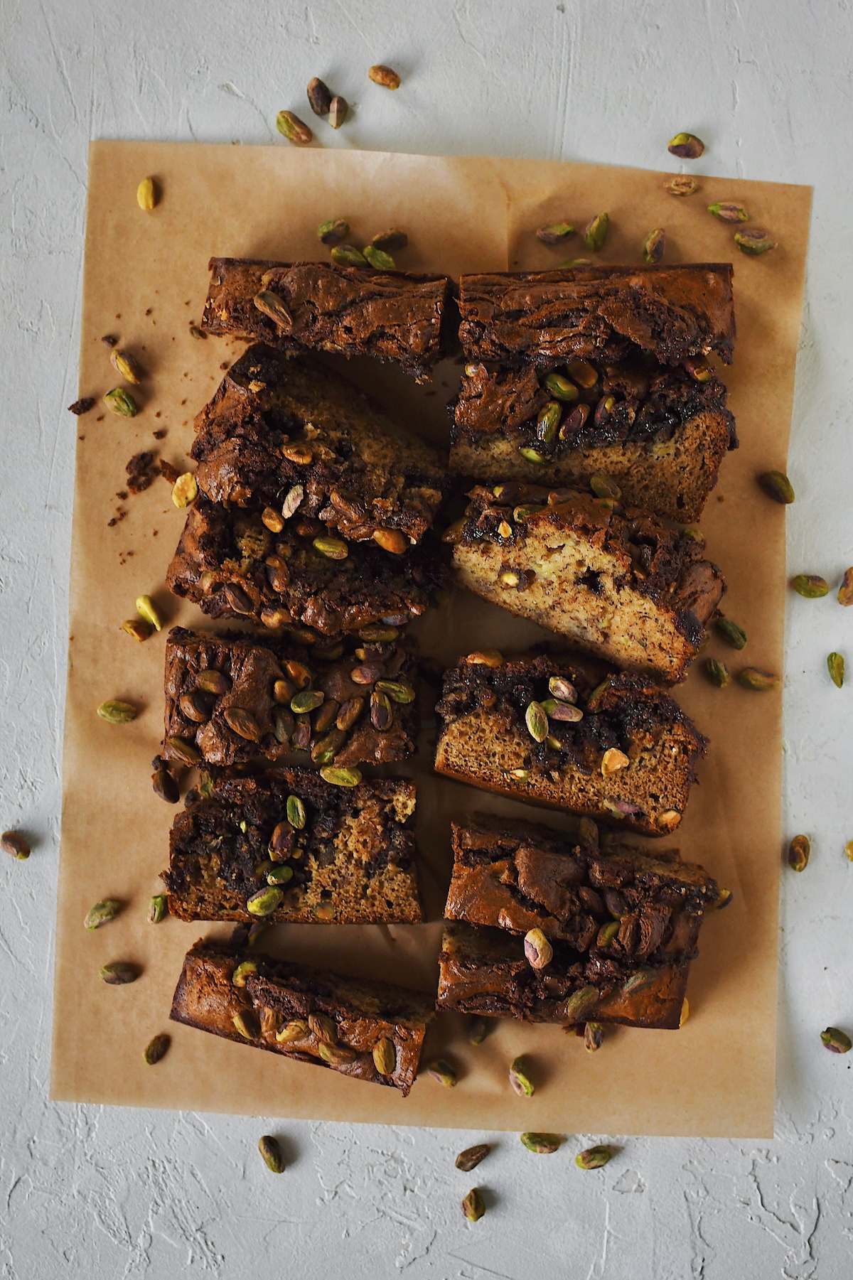Full size photo of pistachio banana bread swirled with nutella, inspired by a dubai chocolate bar.