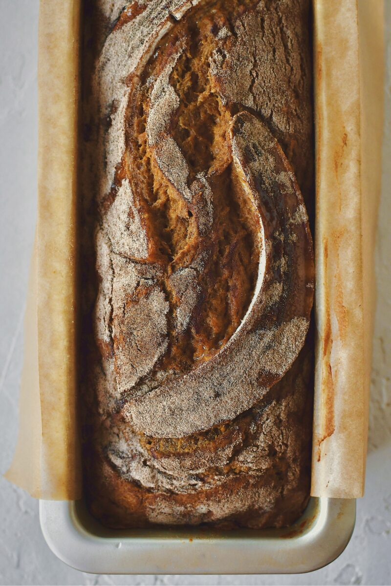 Batter and halved banana topped with cinnamon sugar after baking.