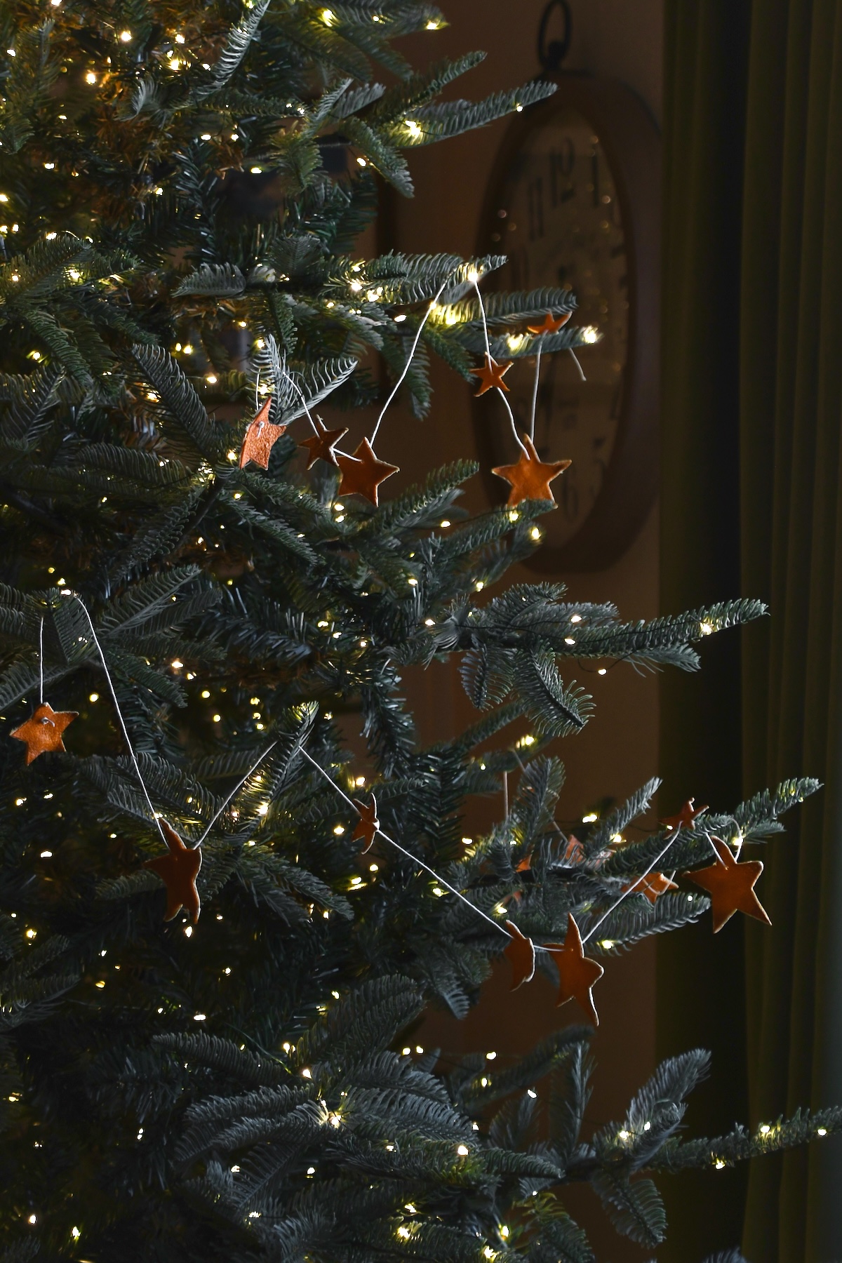 Orange Peel Star Garland strung up on a tree.