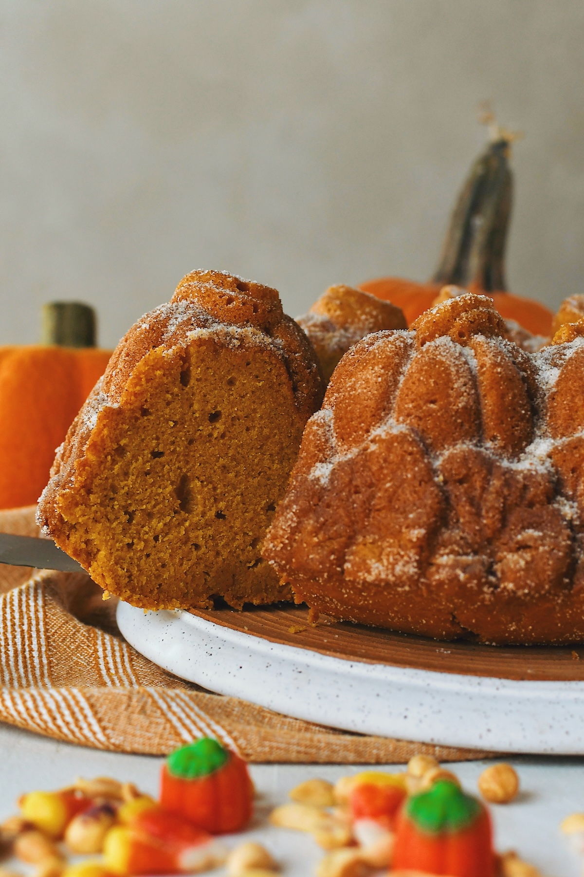 Cutting out a slice of Pumpkin Donut Bundt Cake.